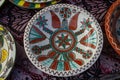 Yakushyntsi, Ukraine, traditional ceramic clay plate on sale, Podillia style flower and geometrical ornament painting Royalty Free Stock Photo