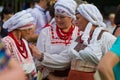 Women in clothes of Ukrainian historical region Podillya share experince, wearing carefully restored shirts, blouses, skirts