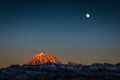 Sichuan Yala snow Mountain at dusk and full moon. sunset in the mountains