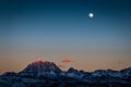 Sichuan Yala snow Mountain at dusk and full moon. sunset in the mountains