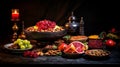 Yalda night traditional food background with pomegranate,watermelon and dried nuts on table