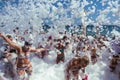 Flakes of snow-white foam fall asleep on cheerful people on the beach, 09/07/2019, Yalta, Crimea