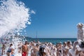 Flakes of snow-white foam fall asleep on cheerful people on the beach, 09/07/2019, Yalta, Crimea