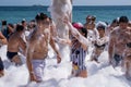 Many cheerful people on the beach in snow-white foam, 09/07/2019, Yalta, Crimea