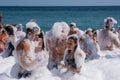 Many cheerful people on the beach in snow-white foam, 09/07/2019, Yalta, Crimea