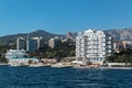 Beautiful view of Crimean resort Yalta from Black Sea. Azure water, white buildings