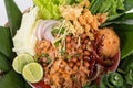 Yam Naem Khao Thot Recipe. Spicy Salad of Curried Rice Croquettes, Fermented Pork, Ginger and Peanuts