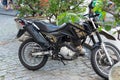 A Yamaha Crosser xtz 150 motorcycle stops on a street in Pelourinho, the historic center of the city of Salvador, Bahia Royalty Free Stock Photo