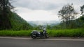 Yamaha Fino scooter in the lush green mountains of Thailand