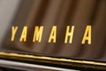 Yamaha logo on a classical piano. close-up view