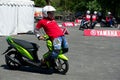 Yamaha scooter stunt drivers. Royalty Free Stock Photo