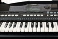 Yamaha synthesizer with musical notes close-up. Music learning concept