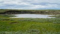 YAMAL PENINSULA, RUSSIA - JUNE 18, 2015: Expedition to the giant funnel of unknown origin. Former crater, which became a Royalty Free Stock Photo