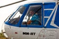 Portrait of a pilot of a MI-8T helicopter close-up in a cockpit window