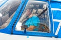 Portrait of a pilot of a MI-8T helicopter close-up in a cockpit window