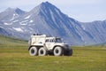 The Trekol all-terrain vehicle against the background of mountains of Polar Ural