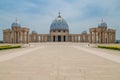 Yamoussoukro, Ivory Coast - February 01 2014: Famous landmark Basilica of our Lady of Peace, African Christian cathedral Royalty Free Stock Photo