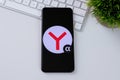 Yandex Browser alpha app logo on a smartphone screen. Royalty Free Stock Photo