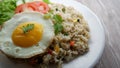 Yang Chow fried rice with slice tomato and cucumber on a white plate Royalty Free Stock Photo