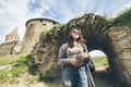 Yang pretty woman tourist in front of castle