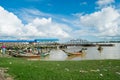 A boat arriving at Botahtaung jetty, carrying Burmese passengers on the Yangon River. Myanmar, Asia