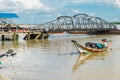 A boat arriving at Botahtaung jetty, carrying Burmese passengers on the Yangon River. Myanmar, Asia