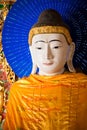 YANGON, MYANMAR - December, 14, 2010: Buddha statue at Shwedagon Pagoda. It is the most sacred Buddhist pagoda for the Burmese.