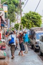 YANGON, MYANMAR - DECEMBER 15, 2016: Electrician working on a street in Yango