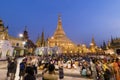 YANGON, MYANMAR, December 25, 2017: Shwedagon Pagoda with believers Royalty Free Stock Photo