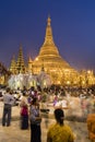 YANGON, MYANMAR, December 25, 2017: Shwedagon Pagoda with believers Royalty Free Stock Photo