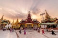 Yangon, Myanmar - Feb 13, 2018: Myanmar peoples and tourists walking around The Shwedagon Pagoda, the most sacred pagoda of Myanma