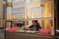 YANGON, MYANMAR - JAN 22: Unidentified ticket seller sits inside