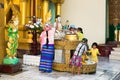 Buddhist family does prayer ritual at Shwedagon Paya pagoda in