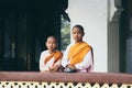 Yangon, Myanmar - March 2019: Buddhist female novice monks stand at the porch in Shwedagon pagoda