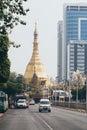 Yangon, Myanmar - March 2019: road leading towards Sule pagoda with traffic on the foreground