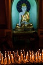 Candles and Buddha in the Shwedagon Pagoda in Yangon Royalty Free Stock Photo