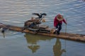 YANGSHUO, CHINA, 6 DECEMBER 2019 Cormorant fisherman on the Li River in Yangshuo