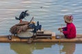 YANGSHUO, CHINA, 6 DECEMBER 2019 Cormorant fisherman on the Li River in Yangshuo