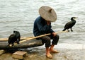 Yangshuo, China: Man with Comorrants