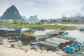 YANGSHUO, CHINA - MAY 26, 2018: Scenic landscape at Yangshuo County of Guilin. Li River (Lijiang River). Pleasure boats at the pi