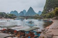 YANGSHUO, CHINA - MAY 26, 2018: Scenic landscape at Yangshuo County of Guilin. Li River (Lijiang River). Pleasure boats at the pi Royalty Free Stock Photo