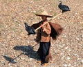 YANGSHUO, CHINA - NOV 5, 2007: Chinese fisherman with two cormorants