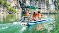 YANGSHUO, CHINA - SEPTEMBER 23, 2016: Tourist cruise boat on a L