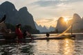 Yangshuo, China Sunset Landscape on Calm River with Villager on