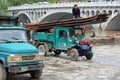 Man collecting the bamboo rafts on the Yulong River China