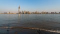 Yangtze river bank with little wave and sand and Wuhan Wuchang d