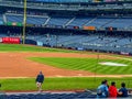 Yankee Stadium bleachers with a few people spectating.