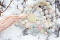 Yantra faceted morganite mala necklace on the white snow