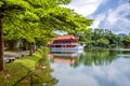 Yao-Yueh Fang Stone boat structure in a pound in Chinese Singapore garden with blue cloudish and reflection Royalty Free Stock Photo