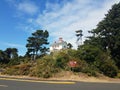Yaquina Bay lighthouse in Newport, Oregon with trees